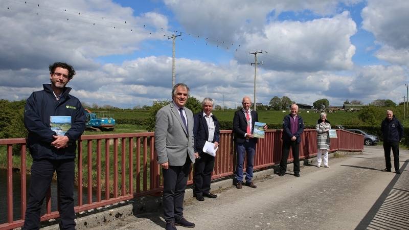 Officials from Waterways Ireland, Failte Ireland and Longford County Council stand on the Red Bridge in Ballymahon, County Longford 
